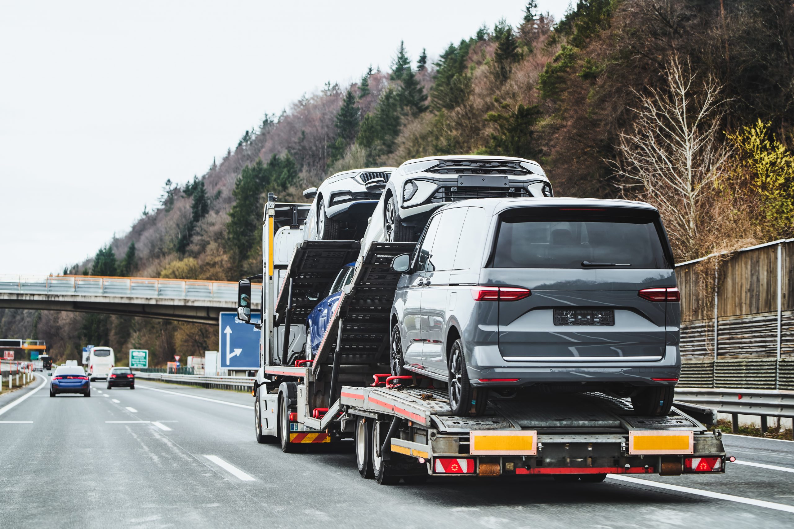 Tow truck hauling car after highway breakdown